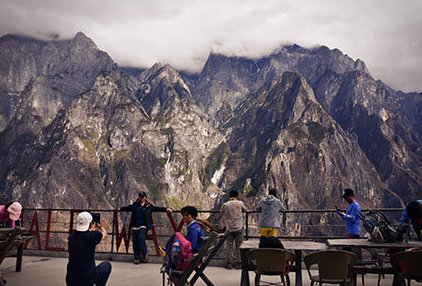 chinese tourists at halfway guesthouse in tiger leaping gorge making pictures during Chinese national holiday