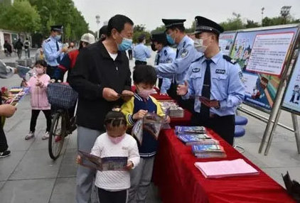 Chinese police enforcing law wear helmet on the scooter 