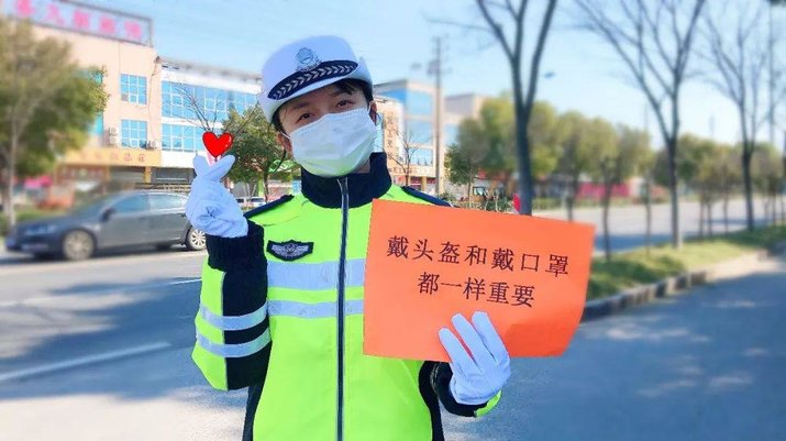 Chinese police enforcing law wear helmet on the scooter 